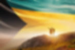The Bahamas flag waving in the sky. A couple hike and enjoy a break look at the top of the