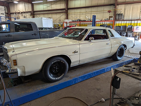 1977 Plymouth Cordoba being serviced at Direct Muffler Brake & Auto Service