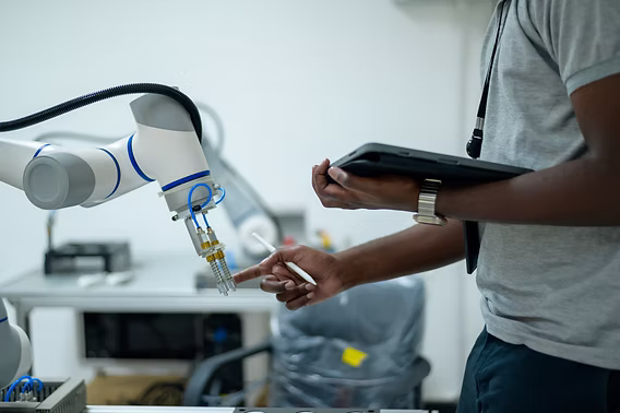 Robotics and control systems — industrial robot arm with operator interface