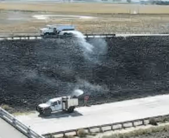 Fort Morgan Fire Department extinguishes a grass fire at I-76 & Long Bridge