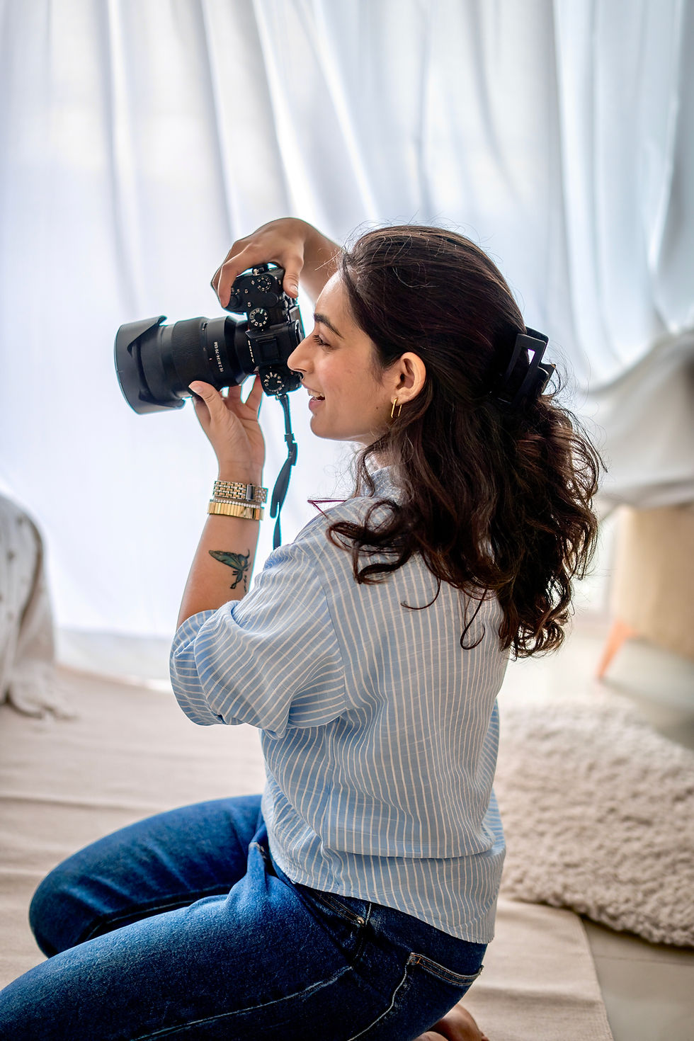 booking a pet photographer to capture memories of your dog. The pet photographer is holding a camera in Mumbai & Bangalore India and taking photographs of a family.