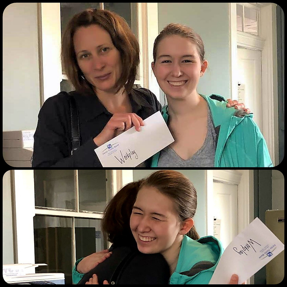 Lilly Gieseke presents the fruits of her fundraising to WordPlay Executive Director Libby Hunter.