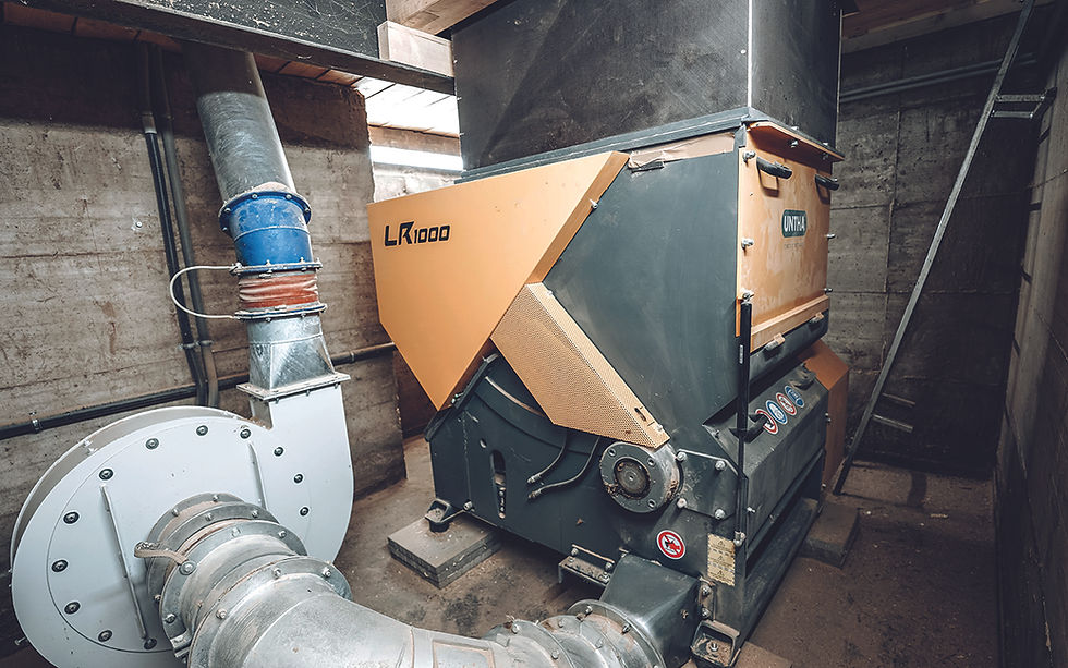 The Kienpointner carpentry workshop uses a pit-mounted UNTHA LR1000