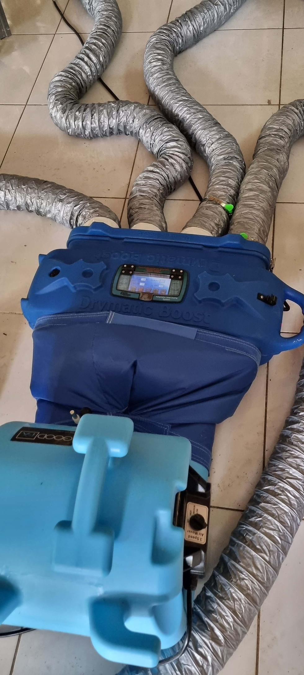 this drying setup using a fan and a heat boost bar to dry a small section of the floor