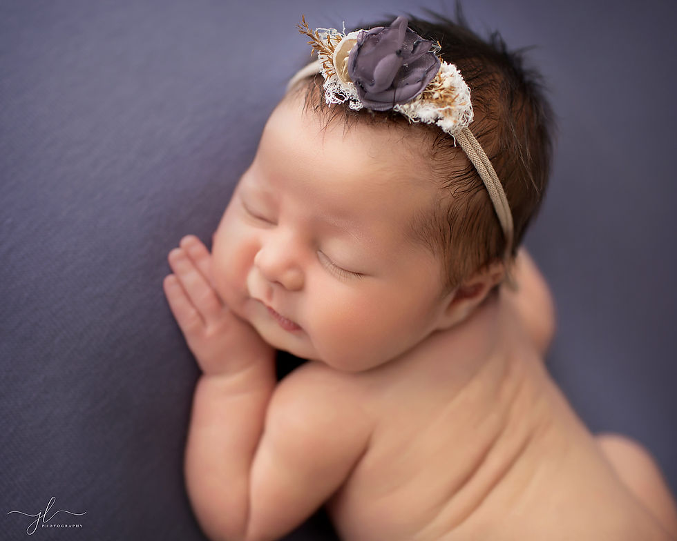 Newborn photos captured in-studio in London, Ontario with a soft, relaxed approach.