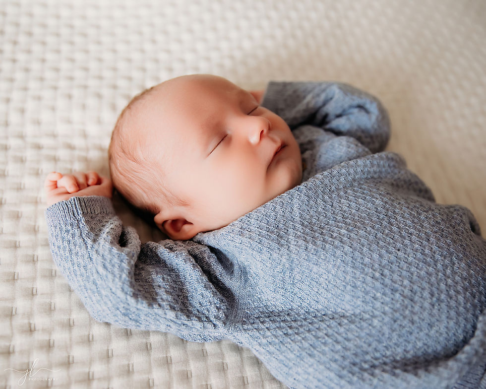 Lifestyle newborn photography London Ontario baby in nursery