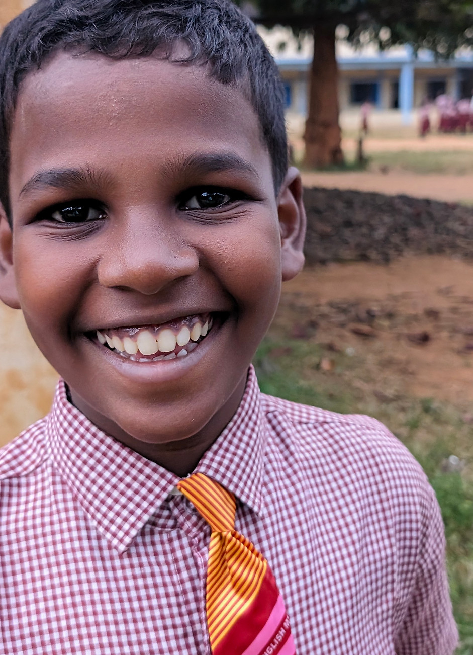 young lad with a big smile