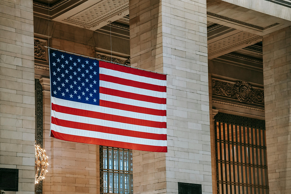 US flag hanging inside a grand building