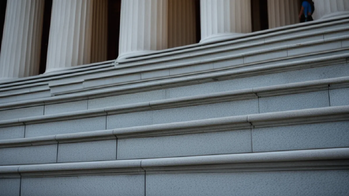 marble steps and columns of a state capitol building at dawn, no signage in Massachusetts, illustrating why a single state fight matters nationally