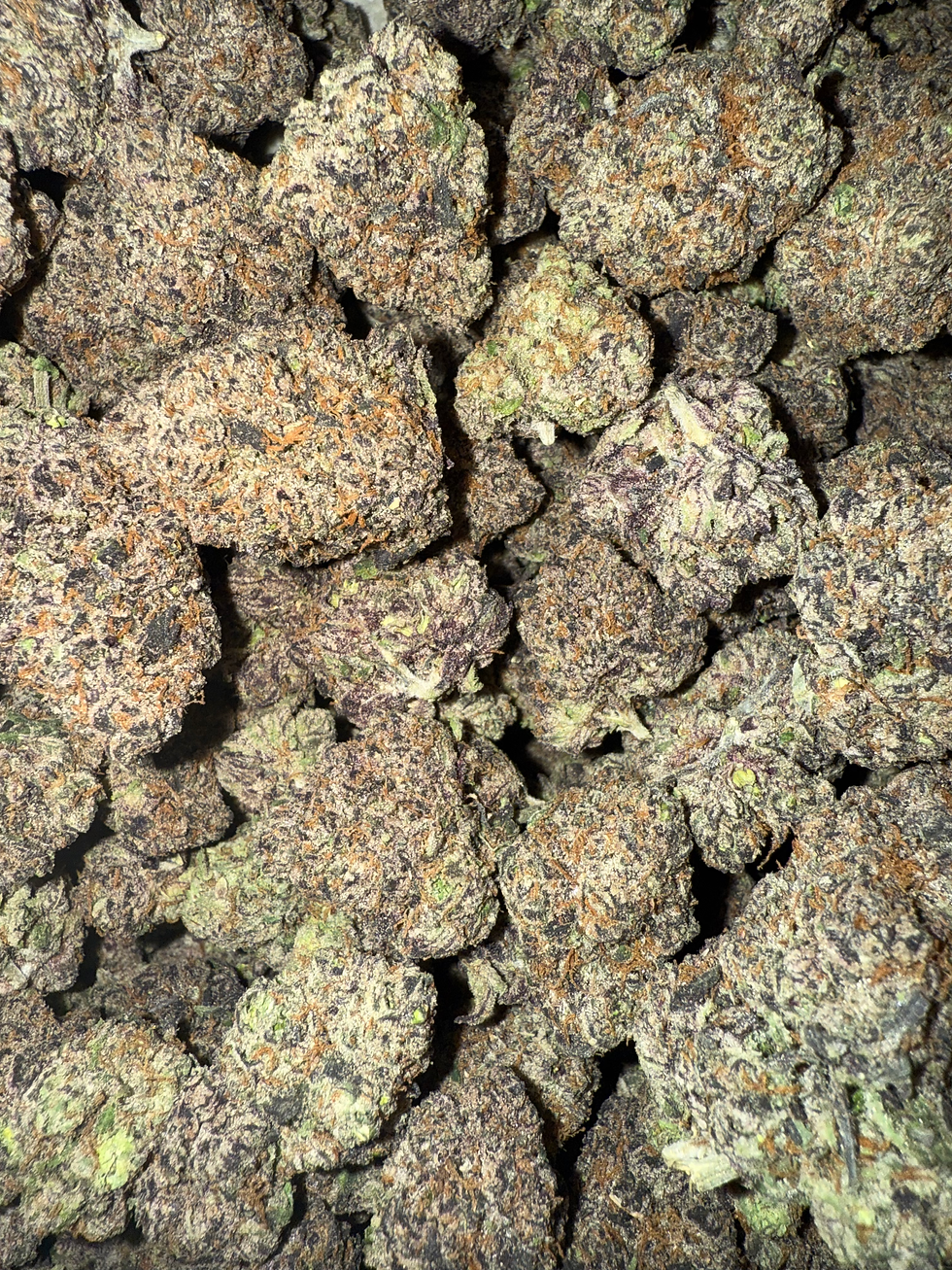 Close-up of Candy x Candy strain showcasing dense trichomes, premium bag appeal, and sugary terpene profile