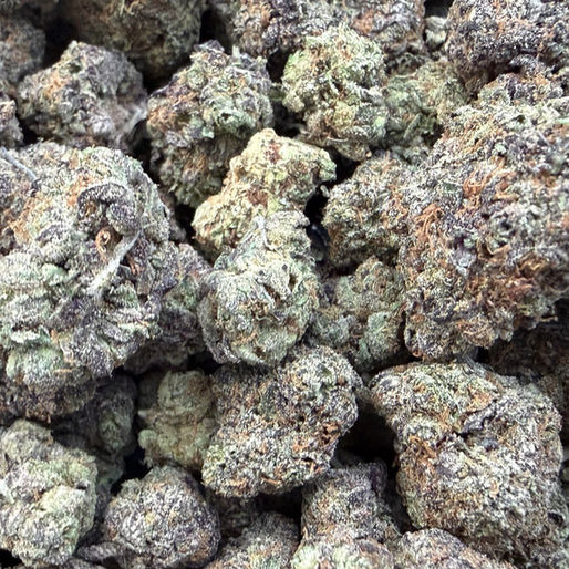 Horchata Swirl cannabis flower representing the appearance of Sour Tangie Strain Guide: Citrus Fuel x Uplifting Focus x Vigorous Grow