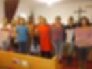 A group of people standing in a church