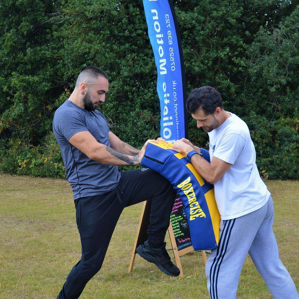 High angle view of a vibrant fitness class participating in a Boxercise session