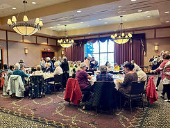 Women socializing in a ballroom.