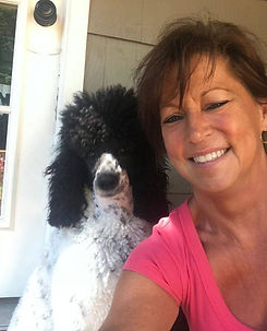 Charlotte Corris Owner and Groomer of Rags to Riches Pet Salon with Frieda her Standard Poodle