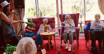 care home residents, music and poms poms