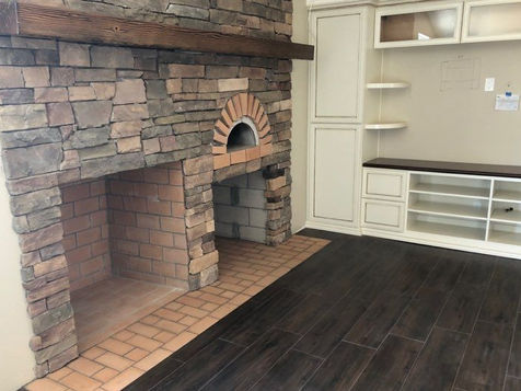 Redlands CA stone fireplace remodel with custom masonry and built-ins