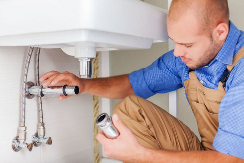 a plumber fixing a problem