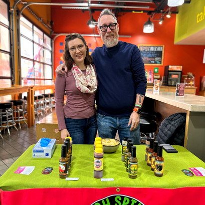 Spike and his partner sampling Irish Spike's Hot Sauce at Third Thursday