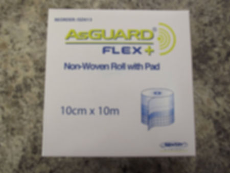 Non woven dressing roll with pad