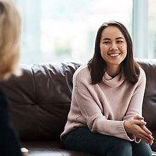 person receiving counselling, sitting on a couch