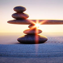 rocks, balanced with sunset behind