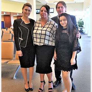 Emel Ersan at the Tampa Immigration Office with her clients after winning their case