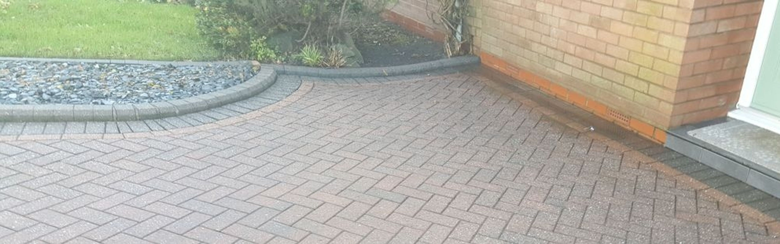 Patio and driveway before cleaning showing dirt moss and algae build-up