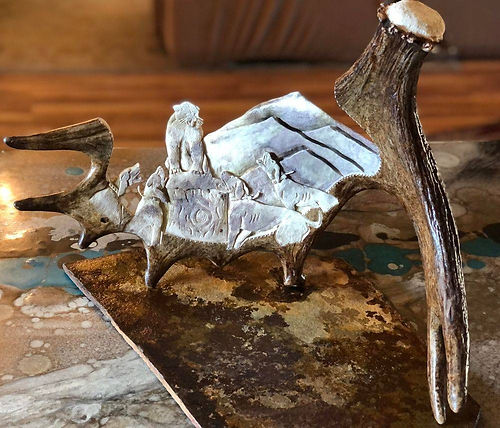 carved on a moose antler, moose antler carving, brown gold, handmade, unique, custom carving, mountain lion treed, 