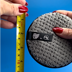 Face Off makeup remover pad by H3® against a measuring tape, very big, measuring 4.5 inches