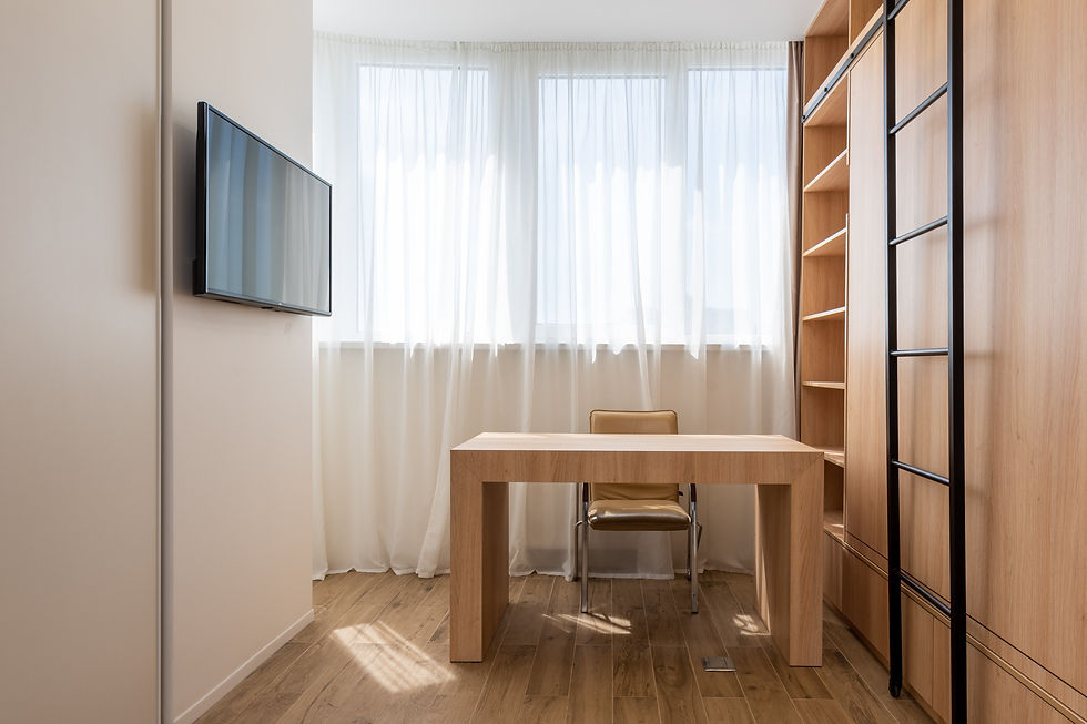 small home office with wood accents, sheer curtains, and black ladder