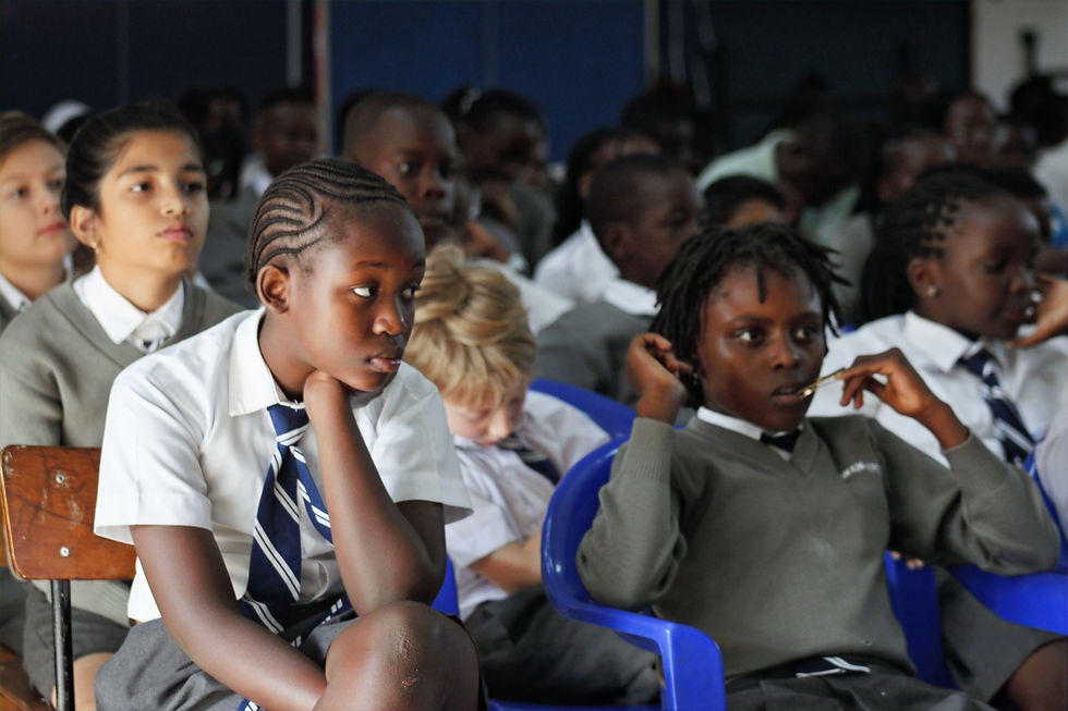 High angle view of students attentively listening during the closing remarks of the assembly