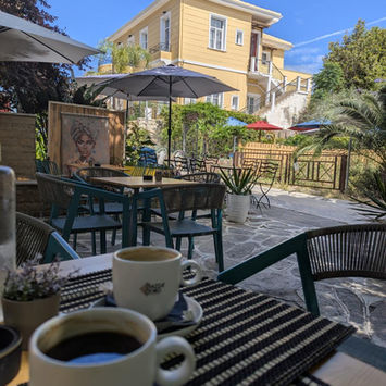Coffee cups on a table in a cafe in Preveza.