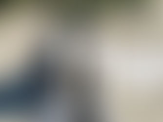 Woman in boots standing outdoors with text “I’m not shrinking. I’m rebuilding capacity after 55,” reflecting midlife energy and resilience.