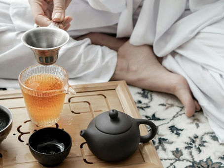 woman resting with tea, supporting her body during stress and immune season