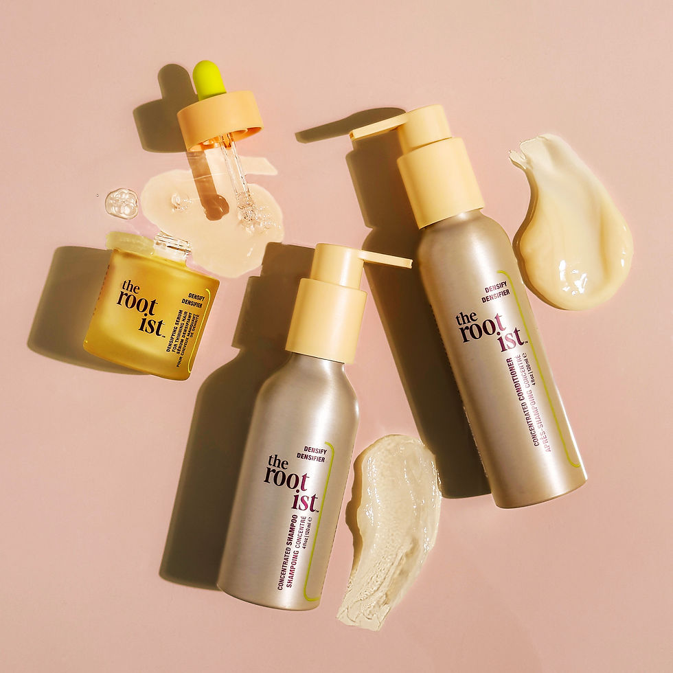 Haircare products for thin or thinning hair on a pink background. Includes a jar, pump bottles, and a dropper. Cream and serum swatches nearby.