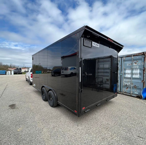 8.5x16 blackout enclosed trailer with tandem 3500 lb brake axles, black poly siding, spoiler kit with strip lighting, tubular steel frame, and 7’ interior height.