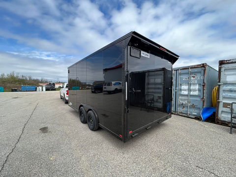 8.5x16 blackout enclosed trailer with tandem 3500 lb brake axles, black poly siding, spoiler kit with strip lighting, tubular steel frame, and 7’ interior height.