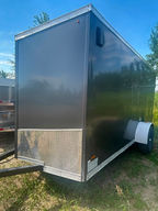 This 2019 Refurbished 6x12 Enclosed Cargo Trailer offers secure storage and dependable hauling at an affordable price. Featuring a rear ramp door, side entry door, clean interior and standard 2-inch ball coupler, it's ready for work or recreational use.