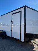 Premium 2026 Canadian Made 7x16 V-nose enclosed trailer featuring a galvanized frame, Whiteout package, tandem 3,500 lb axles with brakes on both axles, ramp door, side entry door, and full tubular construction.
