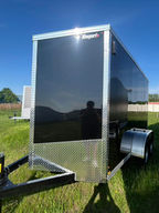 This 2026 Canadian-made 6x12 enclosed trailer combines the convenience of tandem axles with premium construction features including a ramp door, side door, DryMax flooring, LED lighting, and full tubular frame construction. Ideal for contractors, homeowners, powersports, and cargo hauling.
