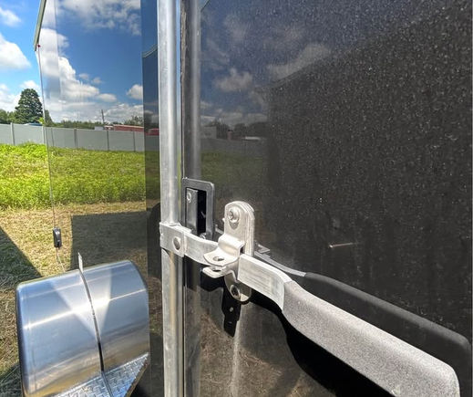 Rear ramp and interior cargo area of aluminum enclosed trailer