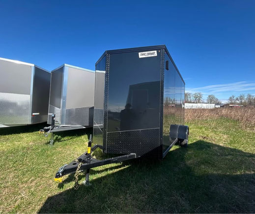 Black enclosed trailer parked outdoors