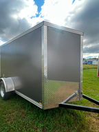 The 2027 Canadian Made 5x10 Enclosed Trailer is a compact cargo trailer built for secure hauling, equipment storage and everyday use. Features include 60" interior height, barn doors, 3,500 lb axle, charcoal polysiding and four D-ring tie-downs.