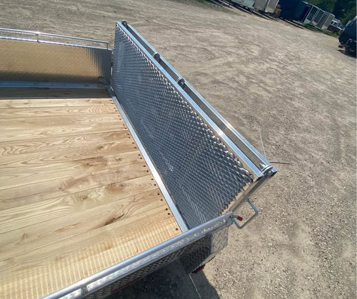 Bifold ramp gate folded on utility trailer