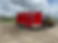 7x16 enclosed cargo trailer featuring a gloss red exterior, blackout trim, tandem axles, rear ramp door, and durable tubular frame construction. In stock now at Team Trailers.