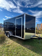 2027 Canadian-made 7 ft x 16 ft V Nose Enclosed Trailer featuring a rear ramp door, 35 x 72.5-inch side door, 83.5-inch interior height, tubular construction, DryMax walls and floors, 3,500 lb axles with brakes, galvanized wheels, and a one-piece aluminum roof.