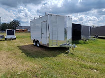 Heavy-duty 7x14 galvanized enclosed trailer featuring tandem 5,200 lb axles, brakes on both axles, 92" interior height, roof rack, side-mounted ladder, ramp door, and three rows of E-track for secure cargo transport.