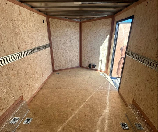 interior rear view of enclosed trailer with ramp door open