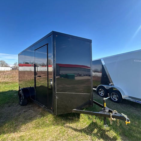 6.5x12 blackout enclosed trailer with ramp door, side door, 7’ interior height, tubular frame construction, and black wheels. Ideal for cargo, motorcycles, contractors, and recreational hauling.
